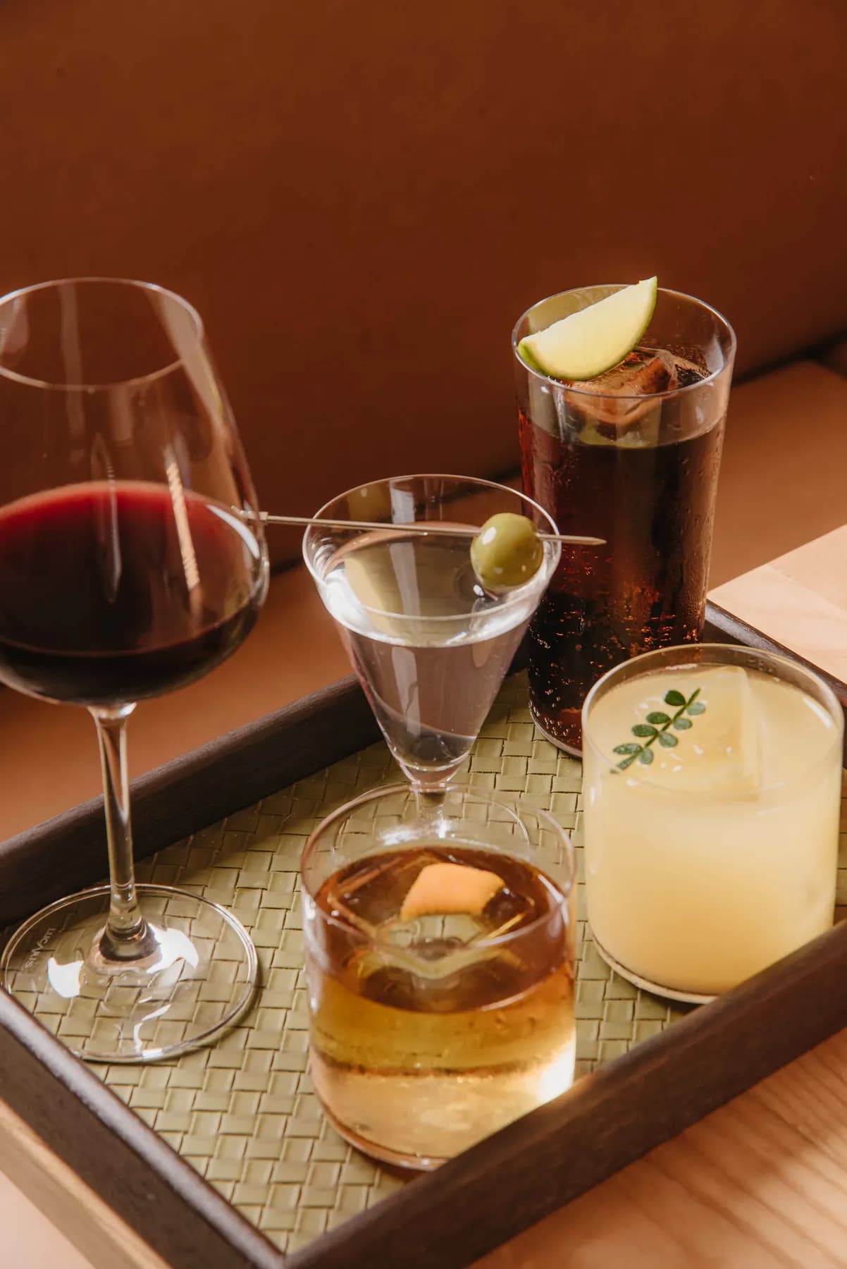 A tray of wine, martini and whisky