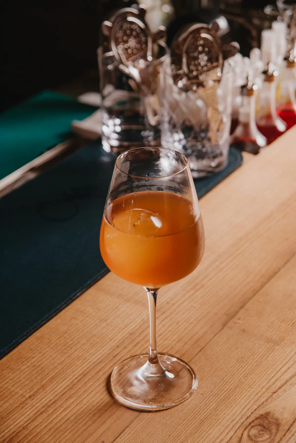 Orange cocktail in a wine glass